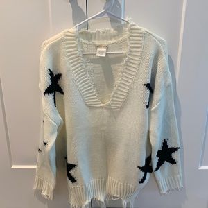 Oversized distressed sweater with stars